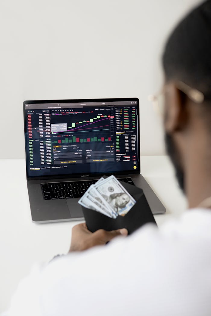 Photo Of Man In Front Of Laptop